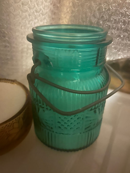 Blue glass jar candle